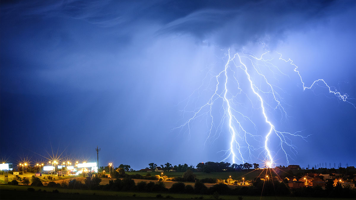 A huge lighting strike over a town