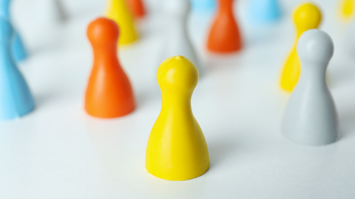 Multi-coloured board game pieces sit on a table