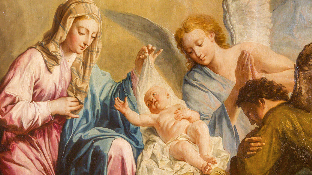 An old painting of the nativity scene, with Mary and angels gazing down at baby Jesus