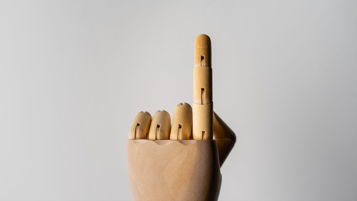 A mannequin hand points with its index finger