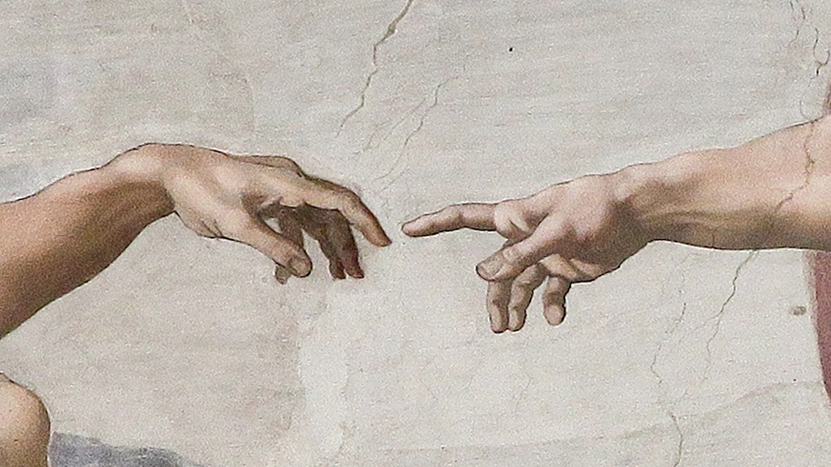 A close up of God and Adam's hands almost touching in the painting "The Creation of Adam" by Michelangelo