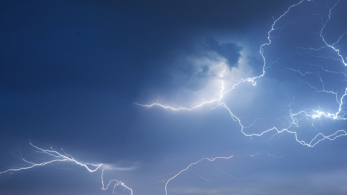 Lightning flashes across the sky
