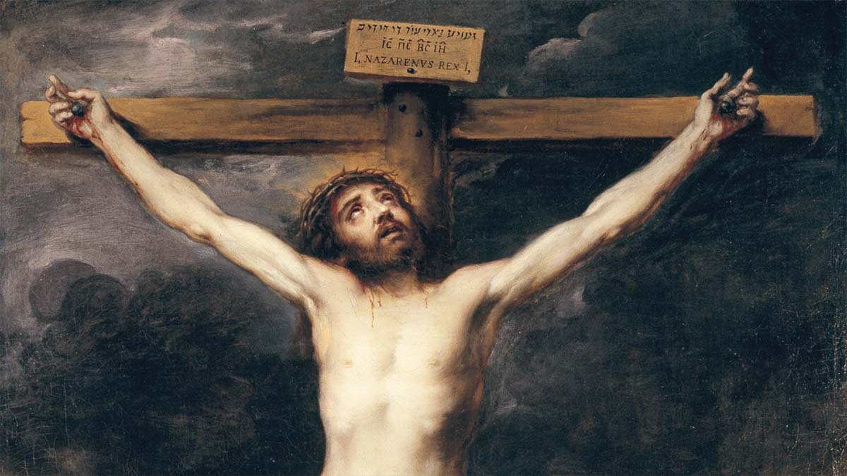 Jesus Christ looks up to the sky as he hangs on the cross